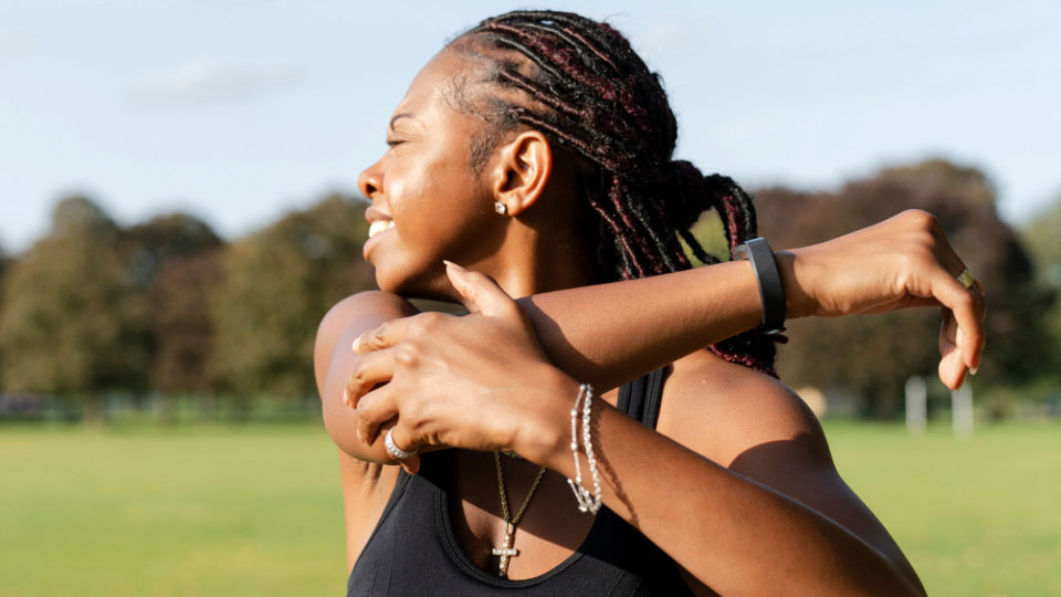 A woman stretching outside